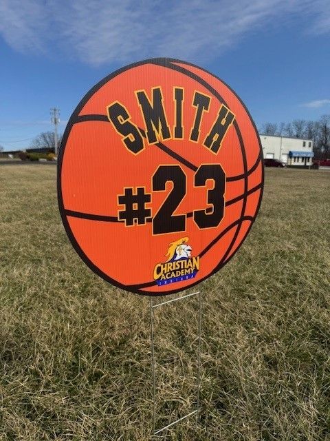 A sign in the shape of a basketball says smith # 23