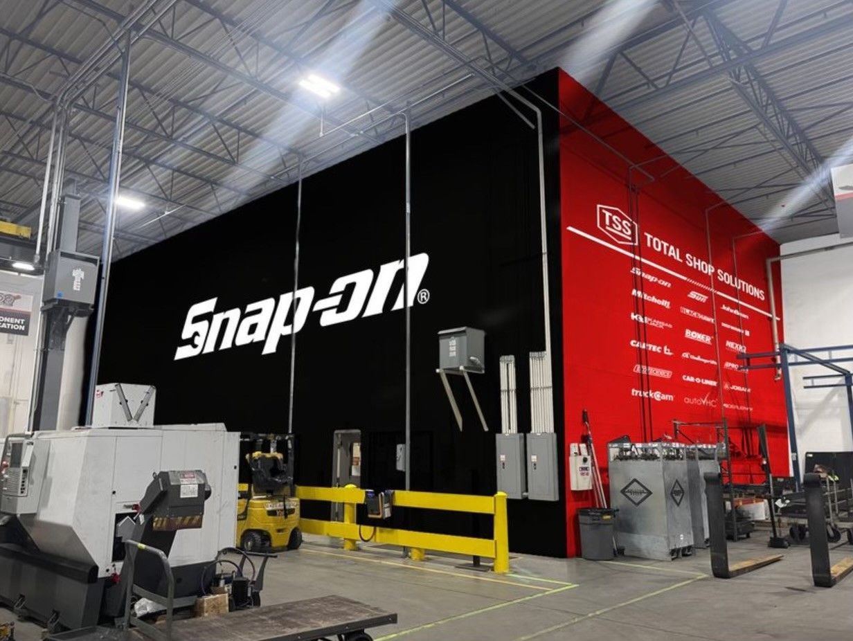 A warehouse with a large snap on sign on the wall