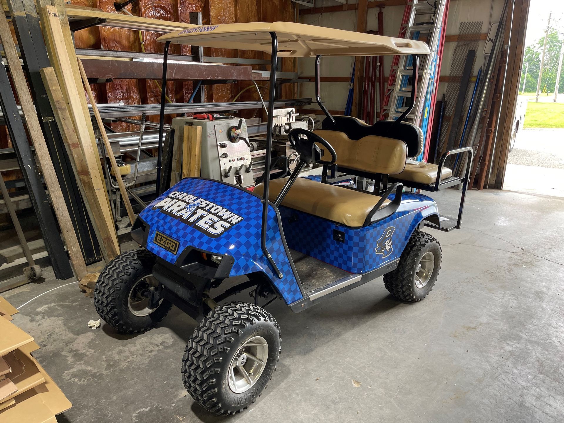 A golf cart with the word greates on it