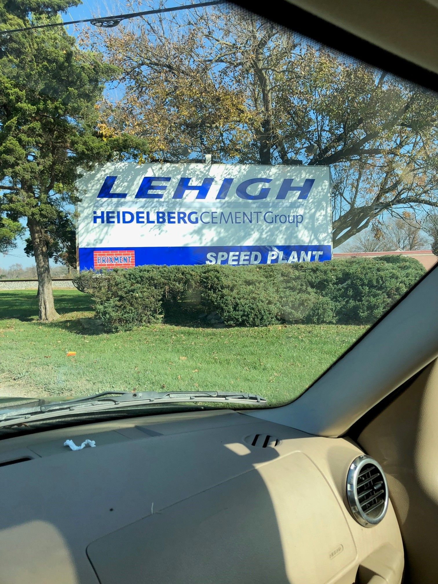 A car with a sticker on the windshield that says lehigh heidelberg cement group