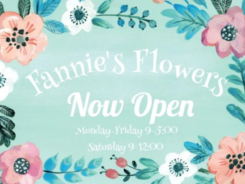A sign that says fannie 's flowers now open