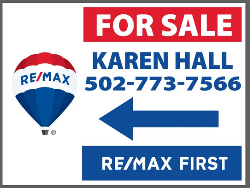 A for sale sign with an arrow pointing to karen hall