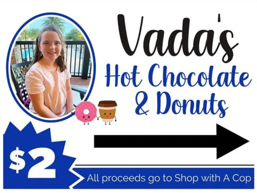 A sign that says vada 's hot chocolate and donuts