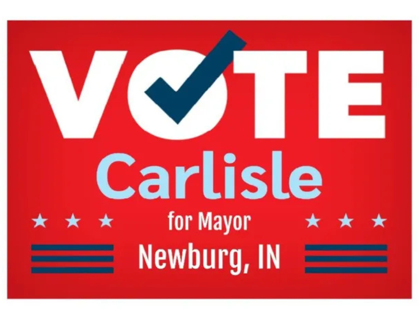 A red sign that says vote carlisle for mayor in newburg in