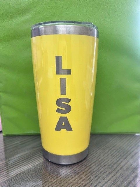 A yellow tumbler with the name lisa on it