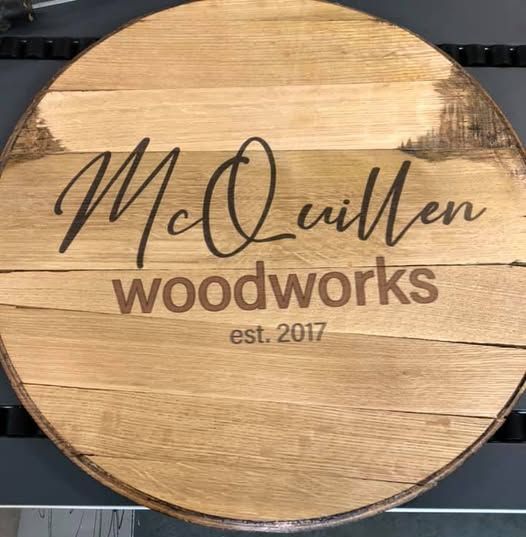 A wooden sign that says mc quillen woodworks on it