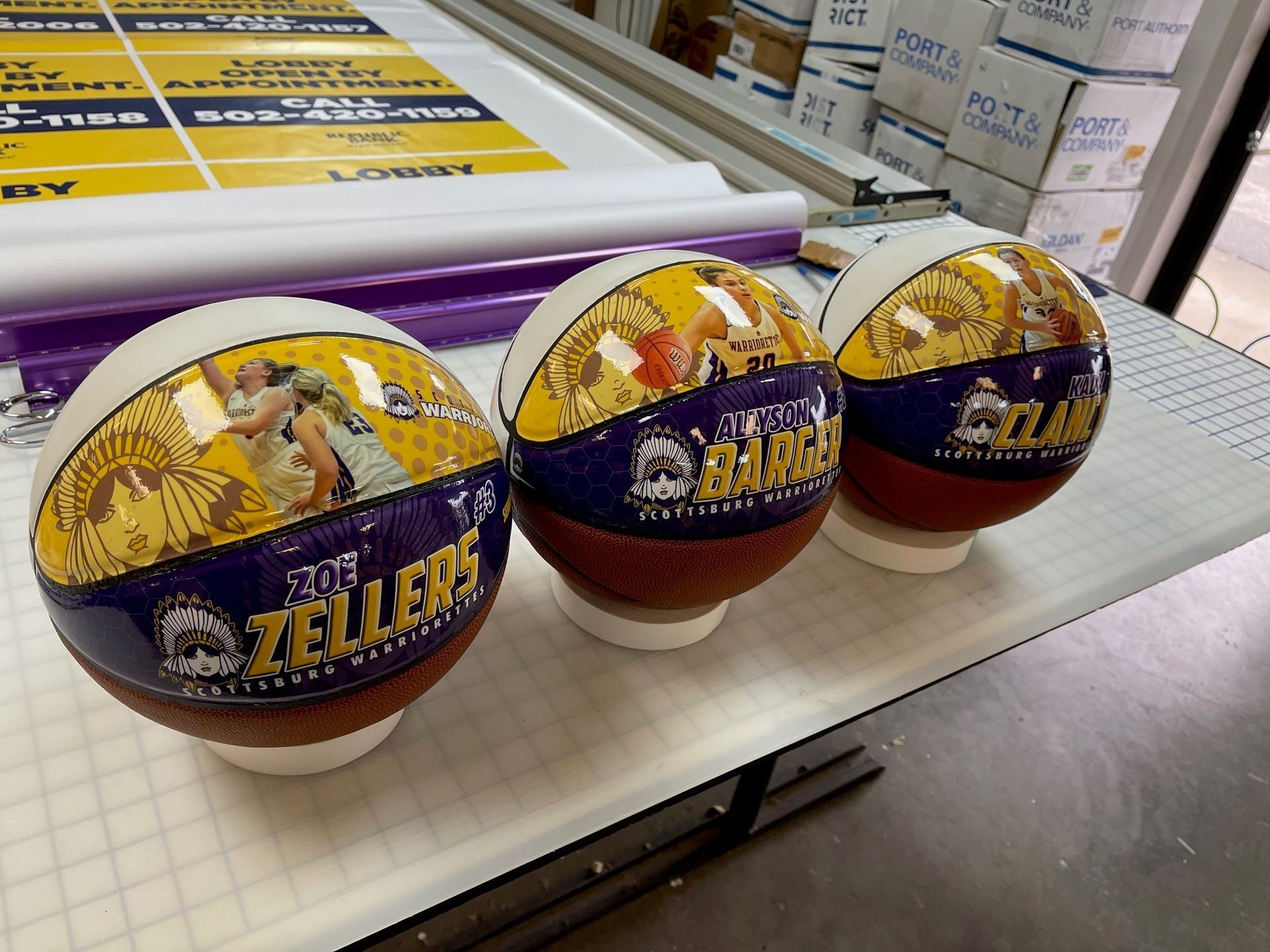 Three zellers basketballs are sitting on a table