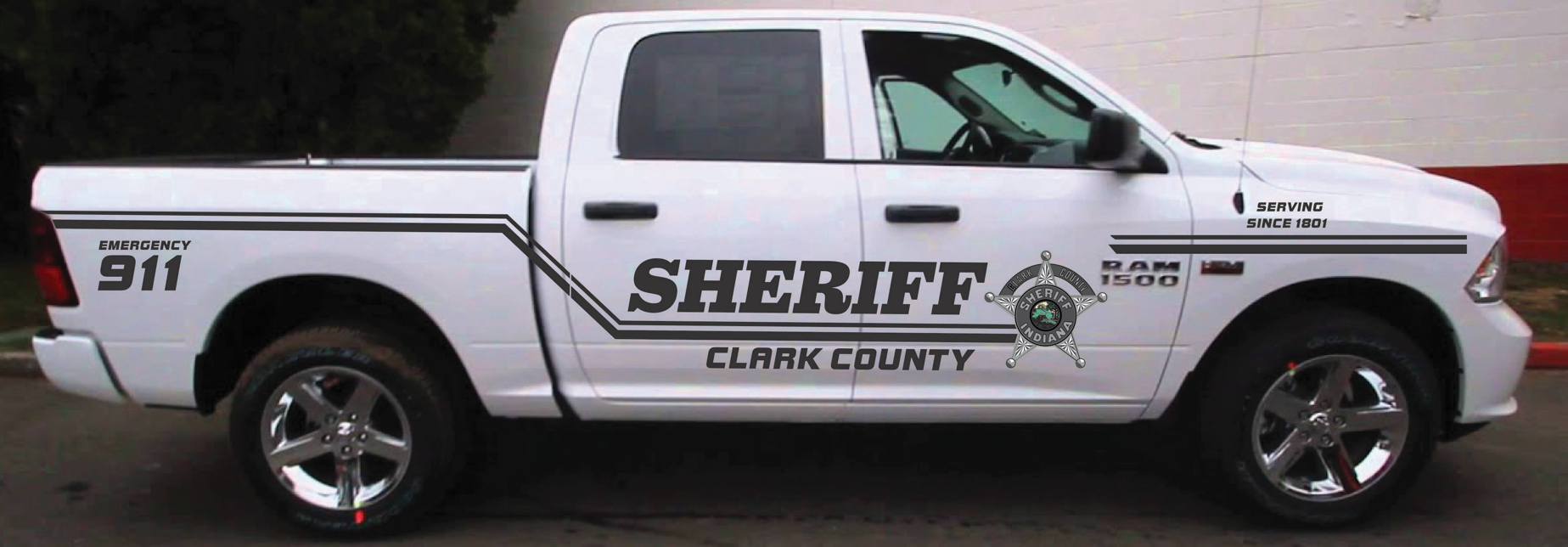A white truck with the word sheriff on it