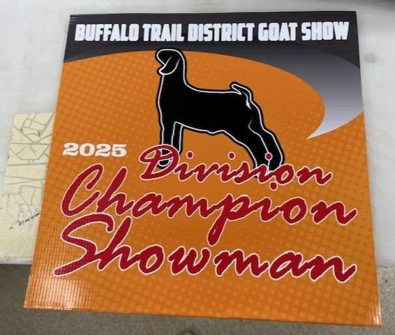 A poster for the buffalo trail district goat show