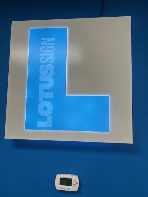 A blue sign that says lotus sign on it