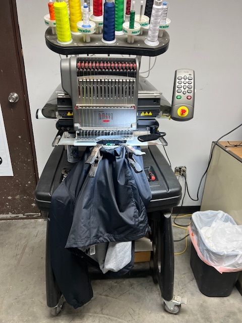 A machine that is sitting on a table with a bag on it
