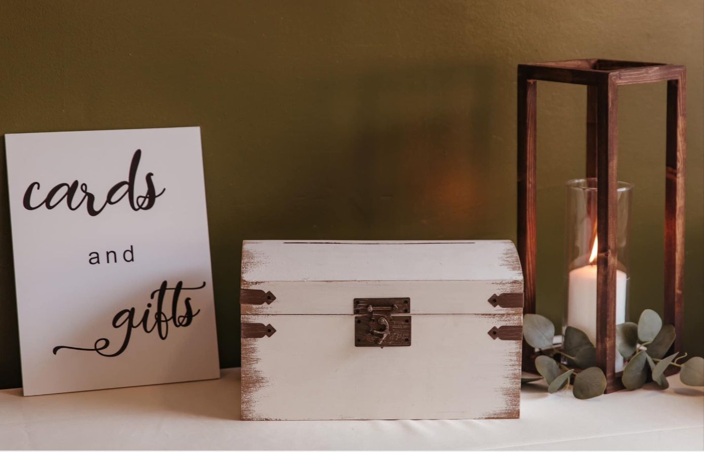 A wooden box with a sign that says cards and gifts