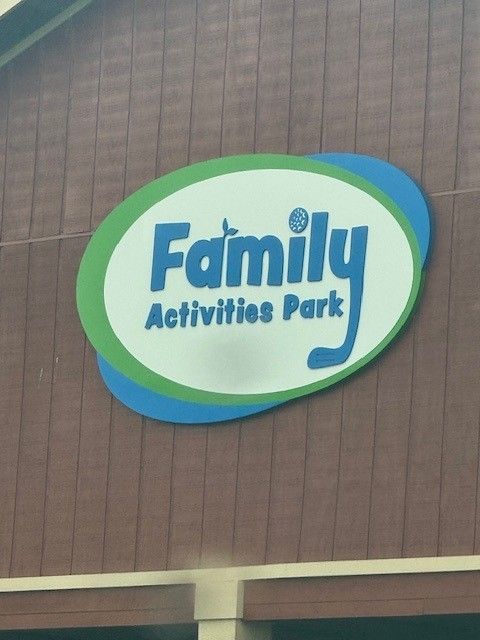 A sign that says family activities park on it