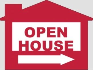 Red house-shaped sign with white text reading