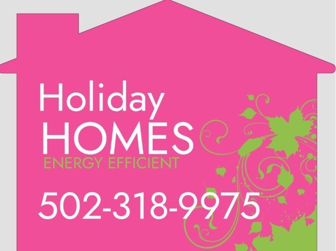 A bright pink house-shaped sign for