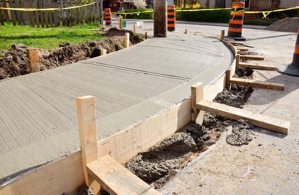 A Concrete Walkway is Being Built on the Side of the Road — C R Concreting in Pittsworth, QLD