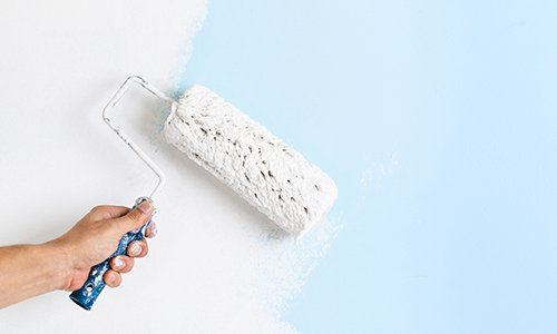 Exterior Painting — Man Painting using Rollers in Colorado Springs, CO