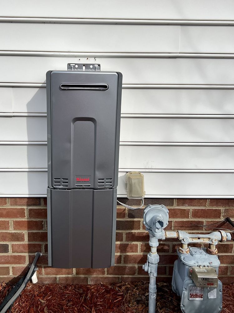air conditioner  is attached to a brick wall