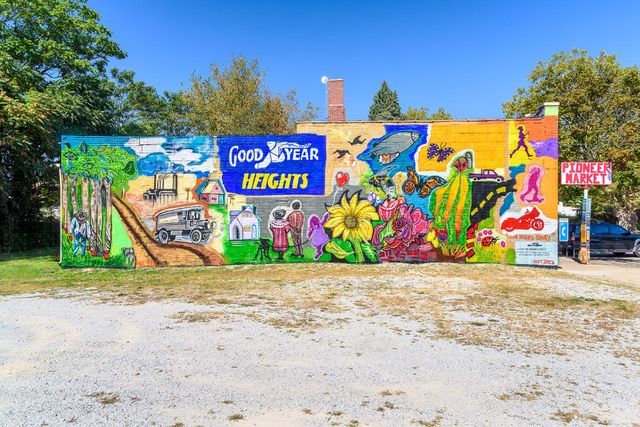 A mural of Goodyear and flowers on a wall