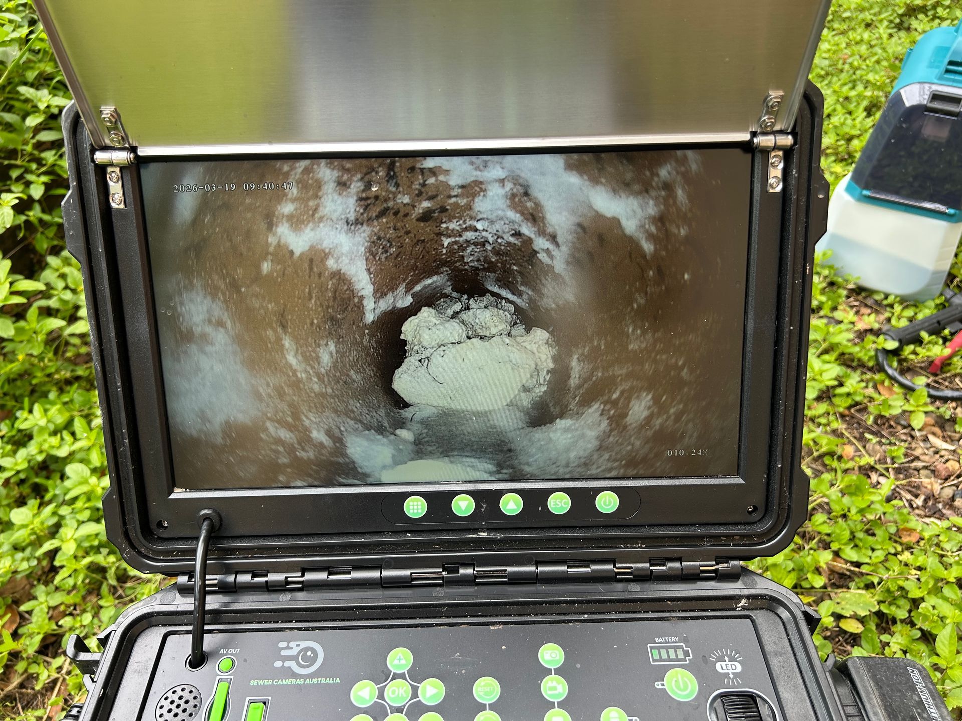 A sewer inspection camera monitor displaying a pipe interior with a large, light-colored blockage — No. 2 Plumbing In Toowong, QLD