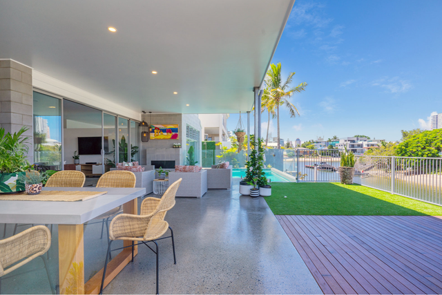 There is a table and chairs on the patio of a house