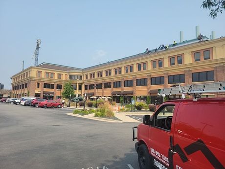 A white roof with a blue sky in the background.