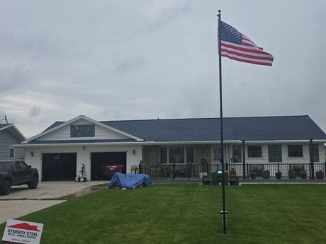 A large house with a large lawn in front of it