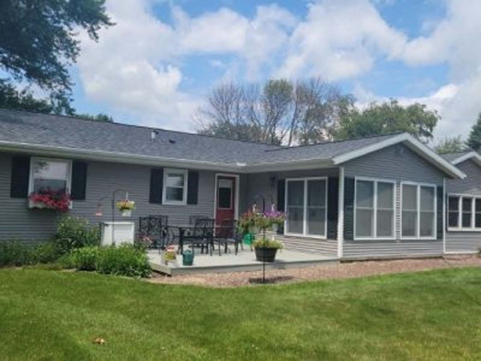 A large house with a large lawn in front of it