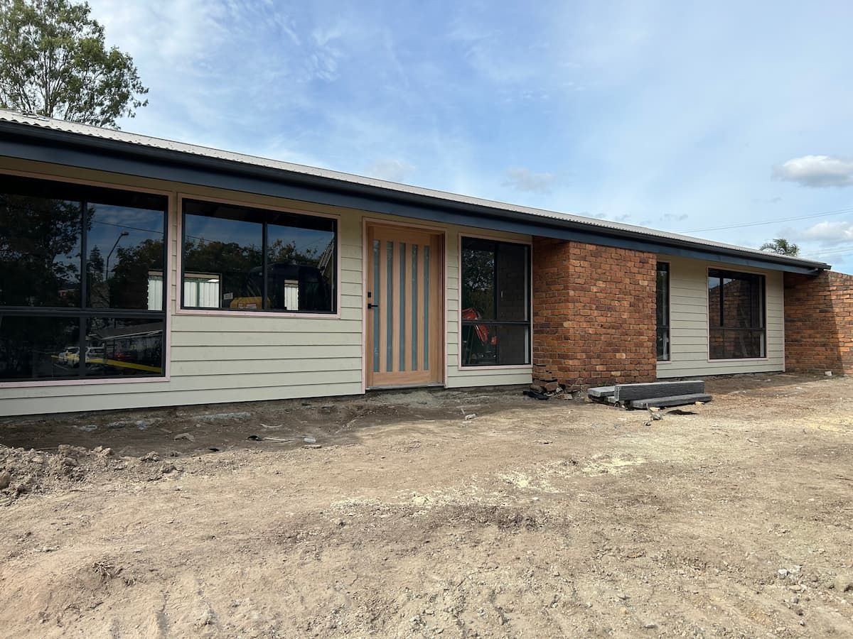 A House Is Being Built In A Dirt Field — Jordan Building & Construction Pty Ltd in Ascot, QLD