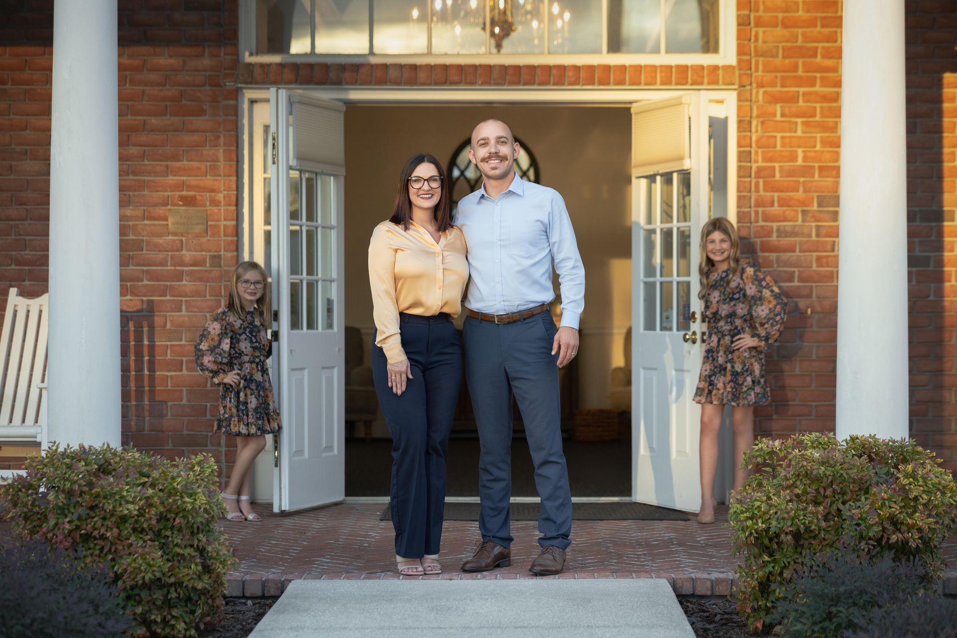 A fountain in a park with palm trees in the background