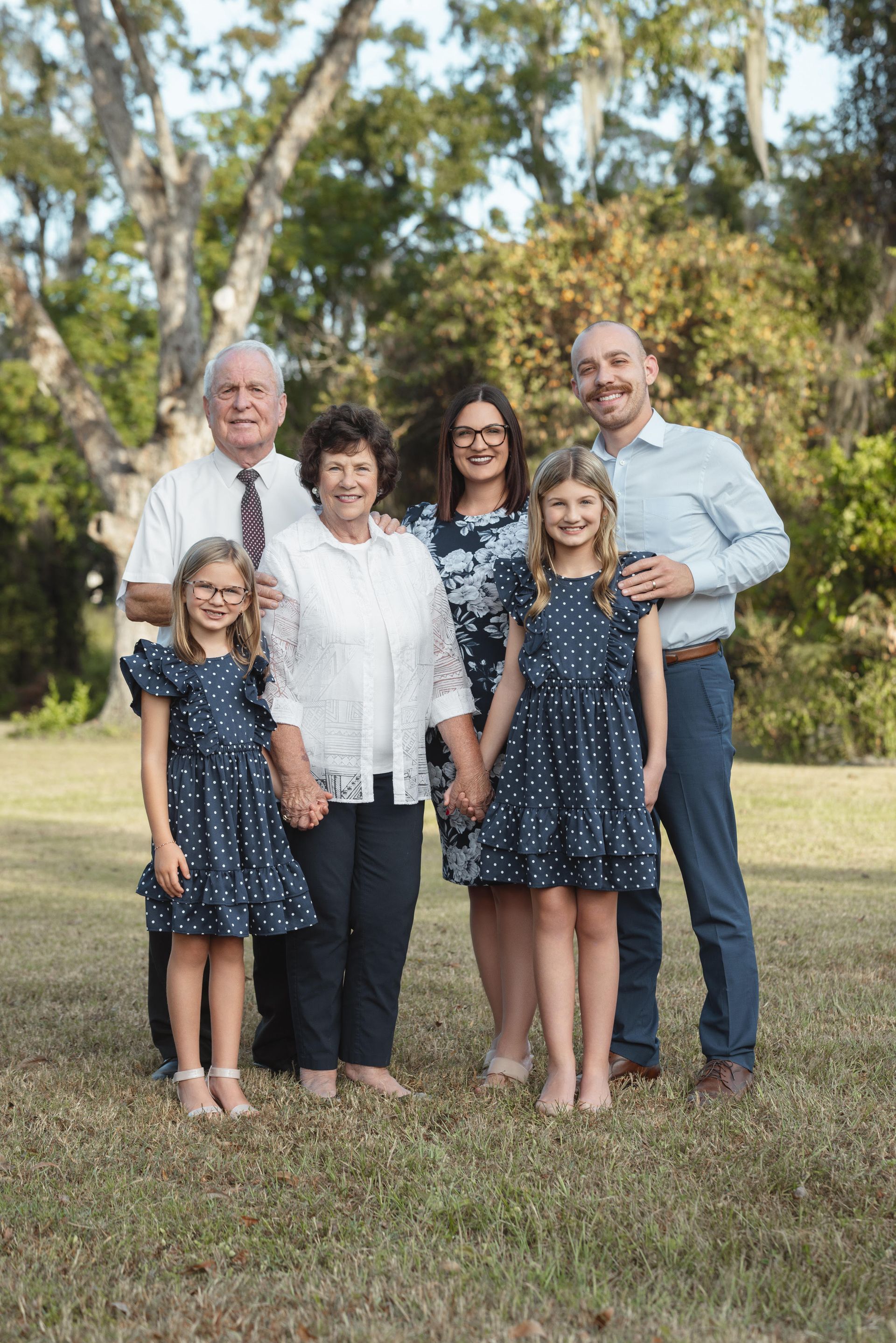 A fountain in a park with palm trees in the background