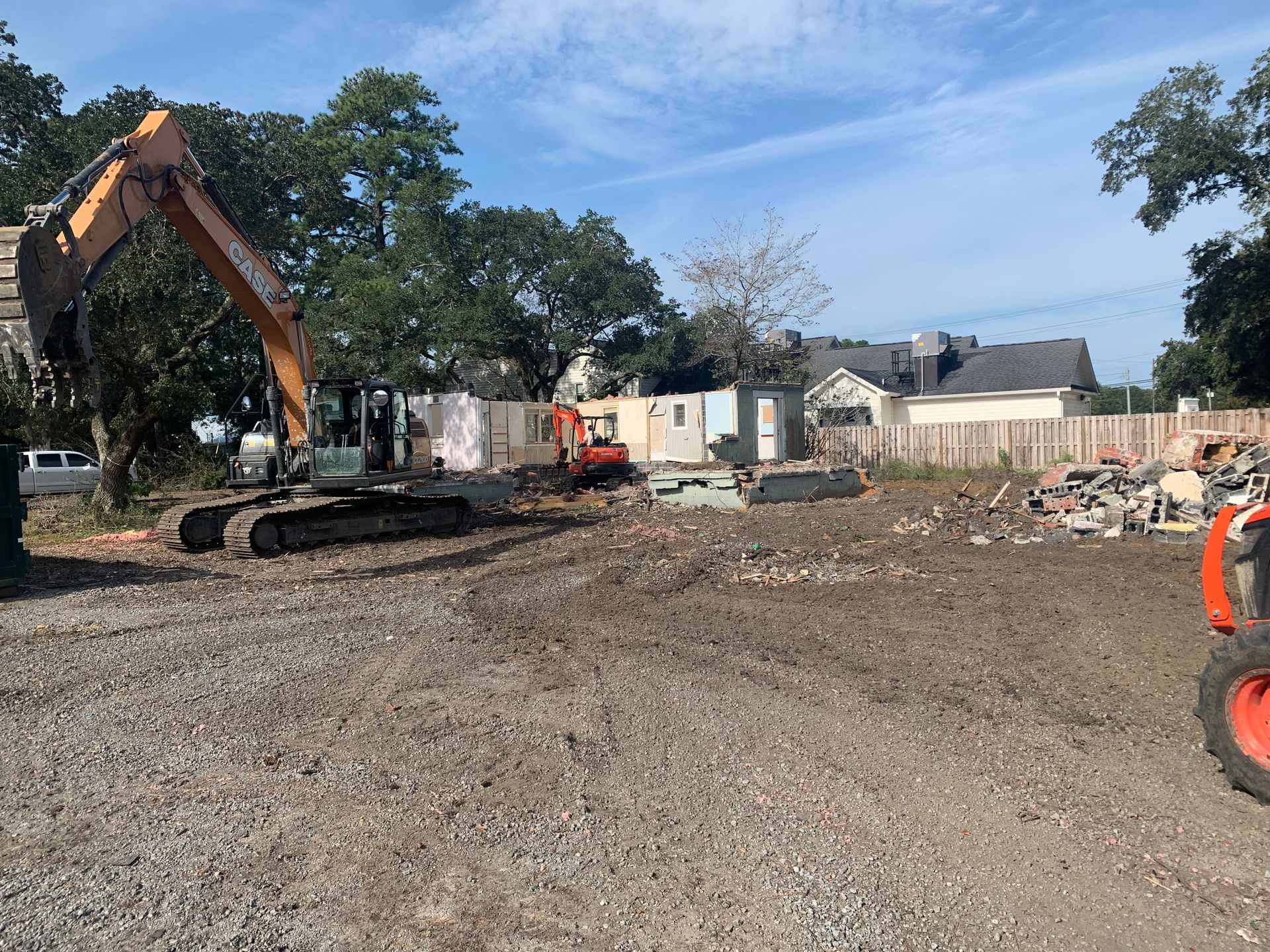 A large excavator is working on a construction site.