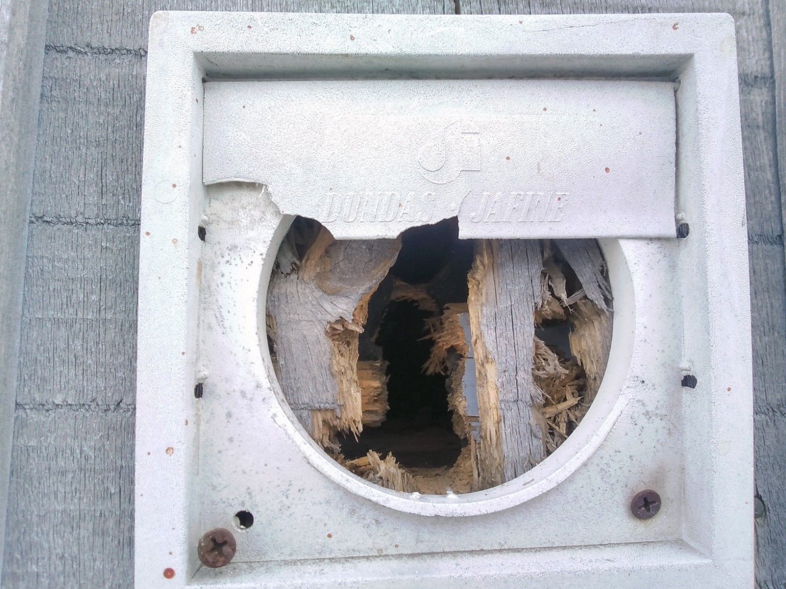 A white square with a hole in the middle of it