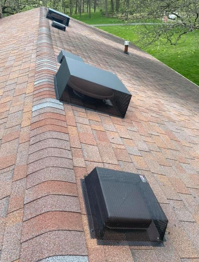 A roof with a lot of vents on it.