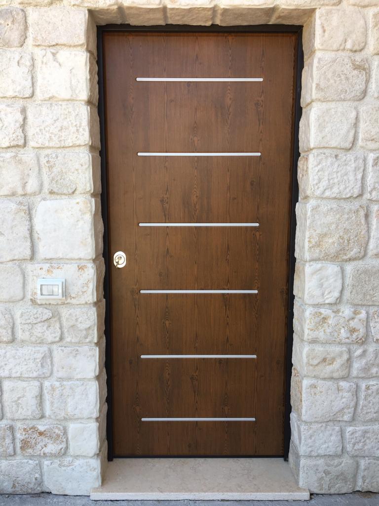 porte e portoni su misura in alluminio e legno