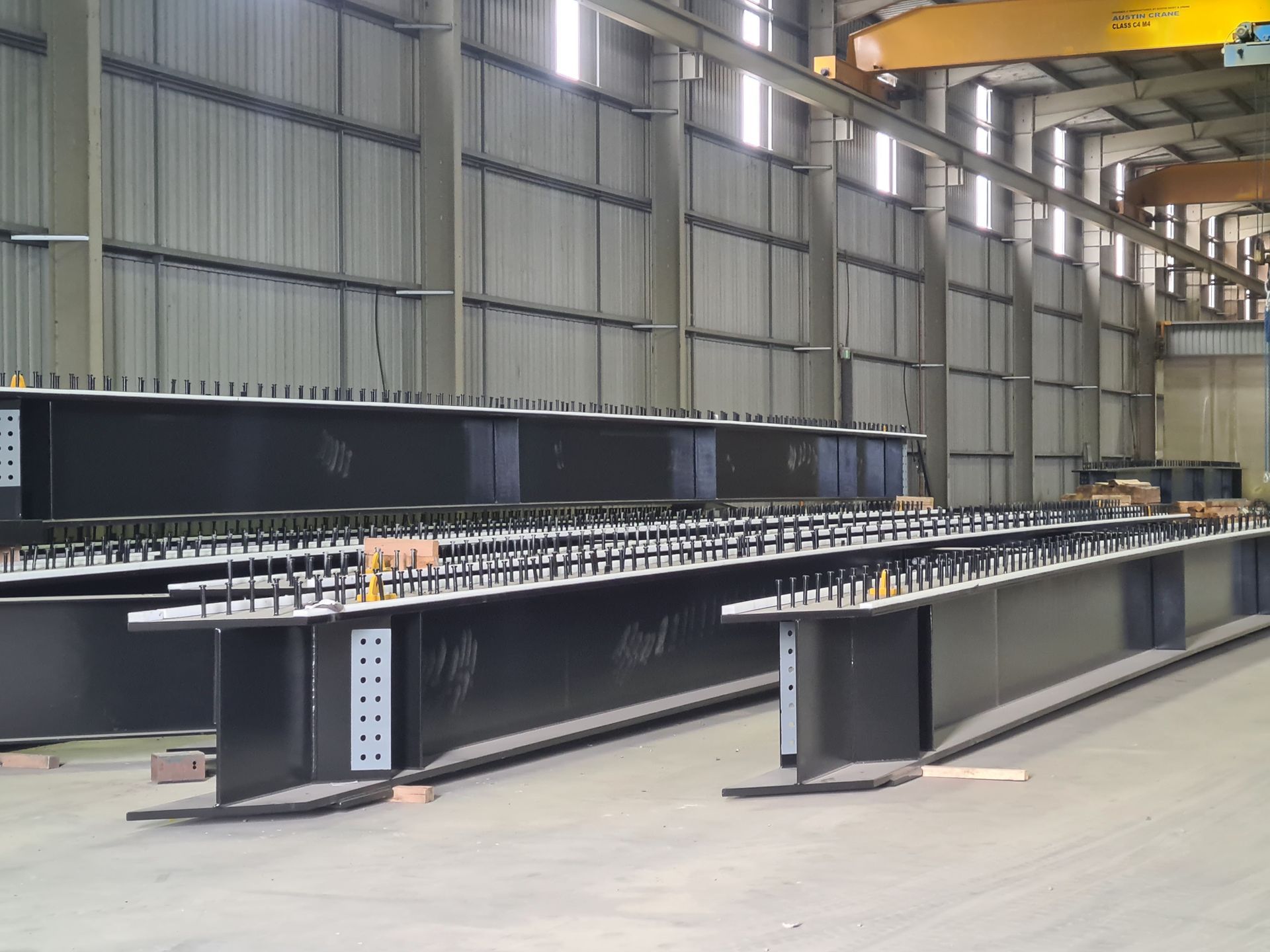 A man is welding a piece of metal with sparks coming out of it.