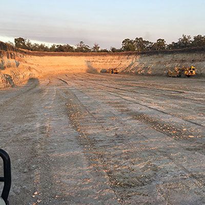 A large dirt field with a lot of tracks in it.