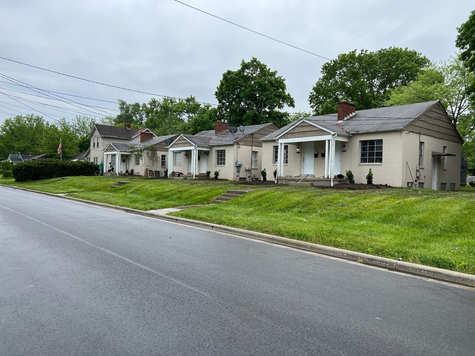 A row of houses on the side of a road