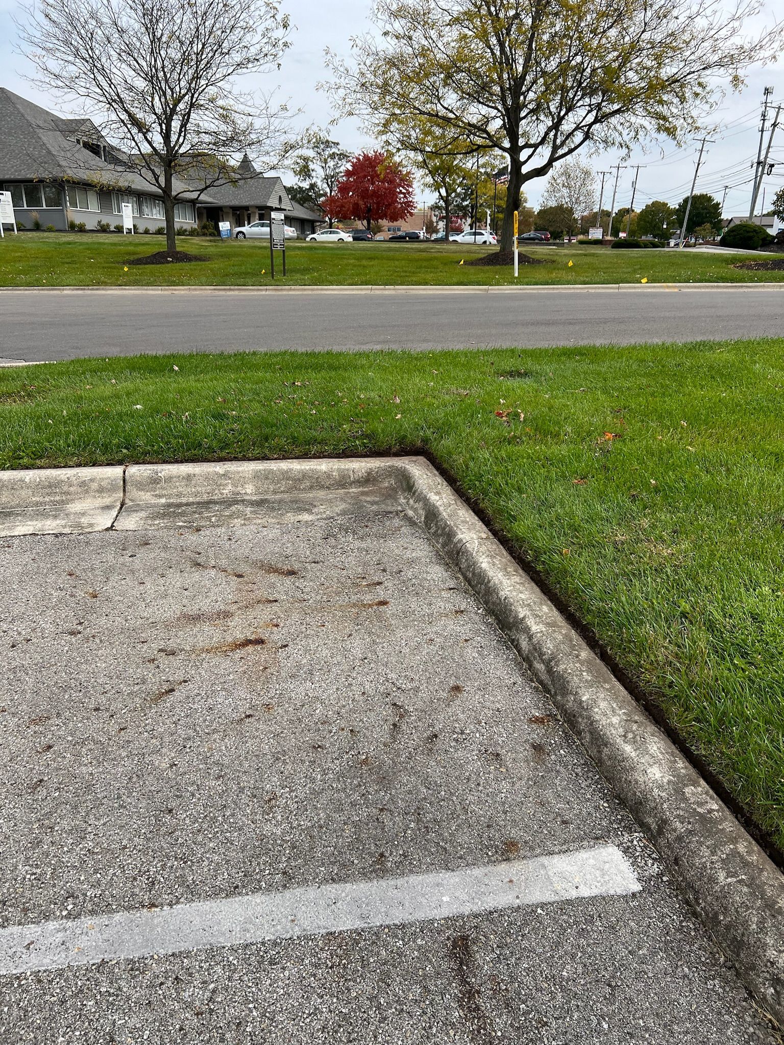 A parking lot with a white line on the side of it.