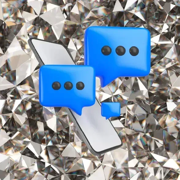 Blue speech bubbles and phone on a faceted silver background, symbolizing messaging.