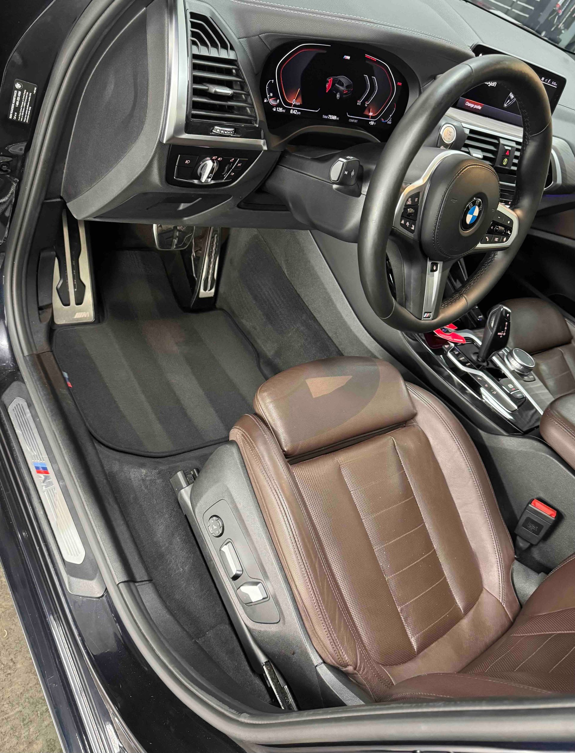 Black Range Rover SUV parked outdoors at sunset.