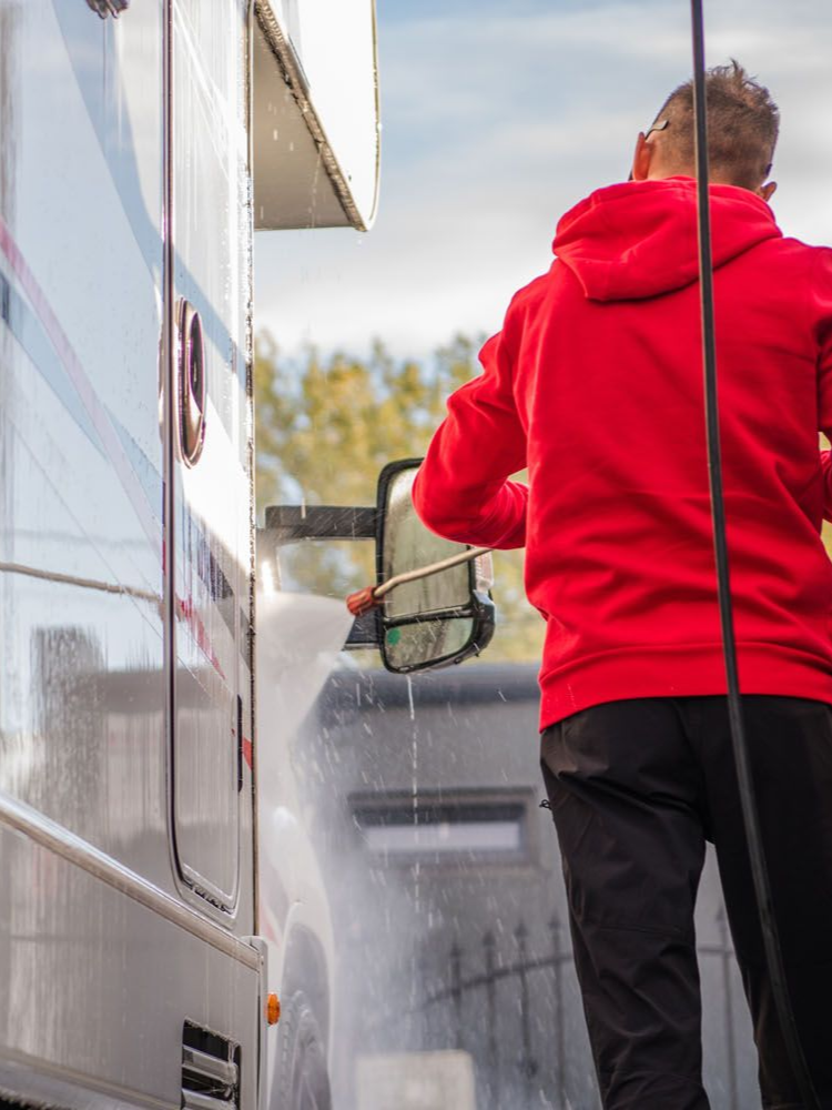 Blue and chrome Harley-Davidson motorcycle front view, showcasing custom wheels, bright lights, and polished details.