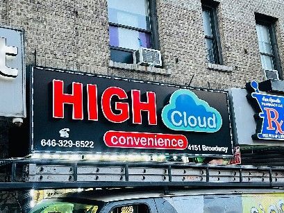 A sign for high cloud convenience is on the side of a building