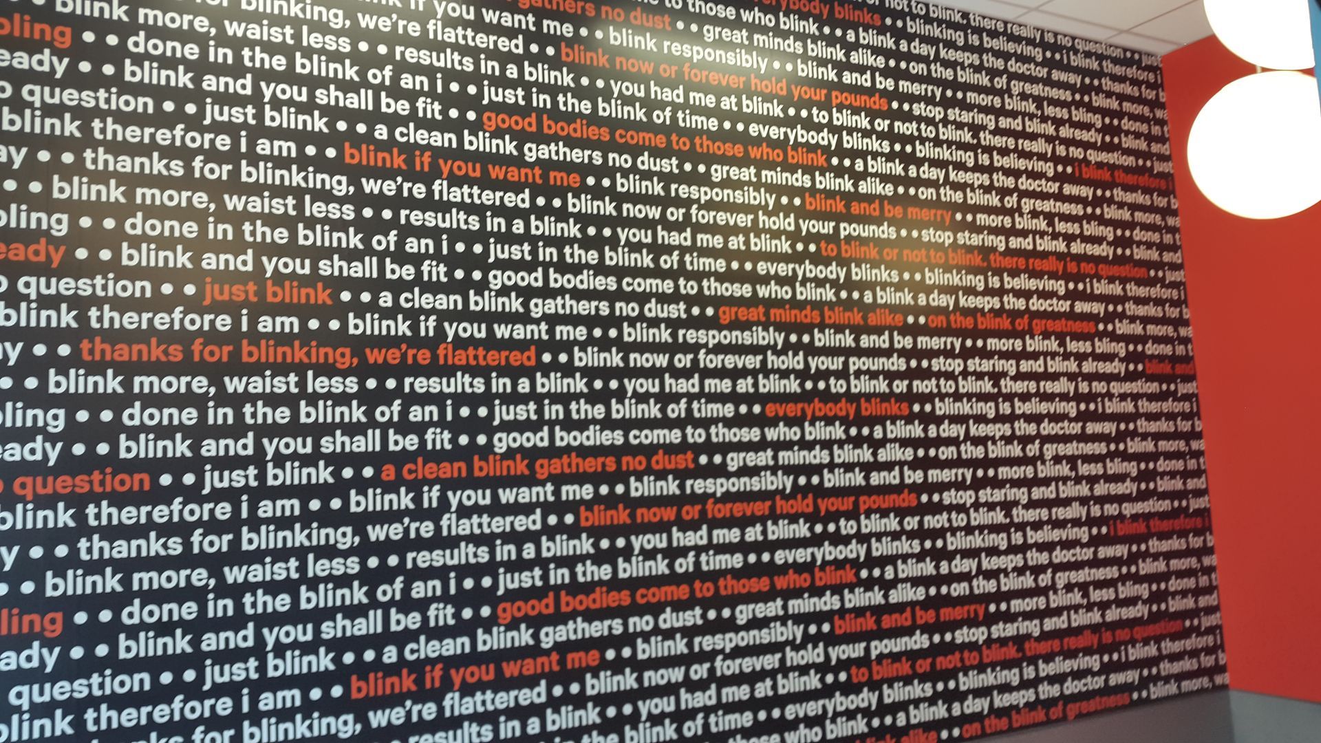 A wall that has a lot of words on it
