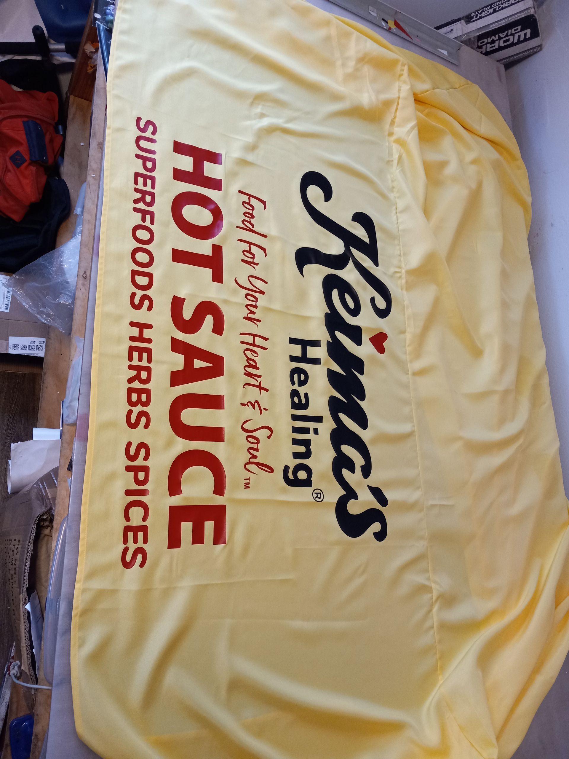 A yellow towel that says hot sauce on it