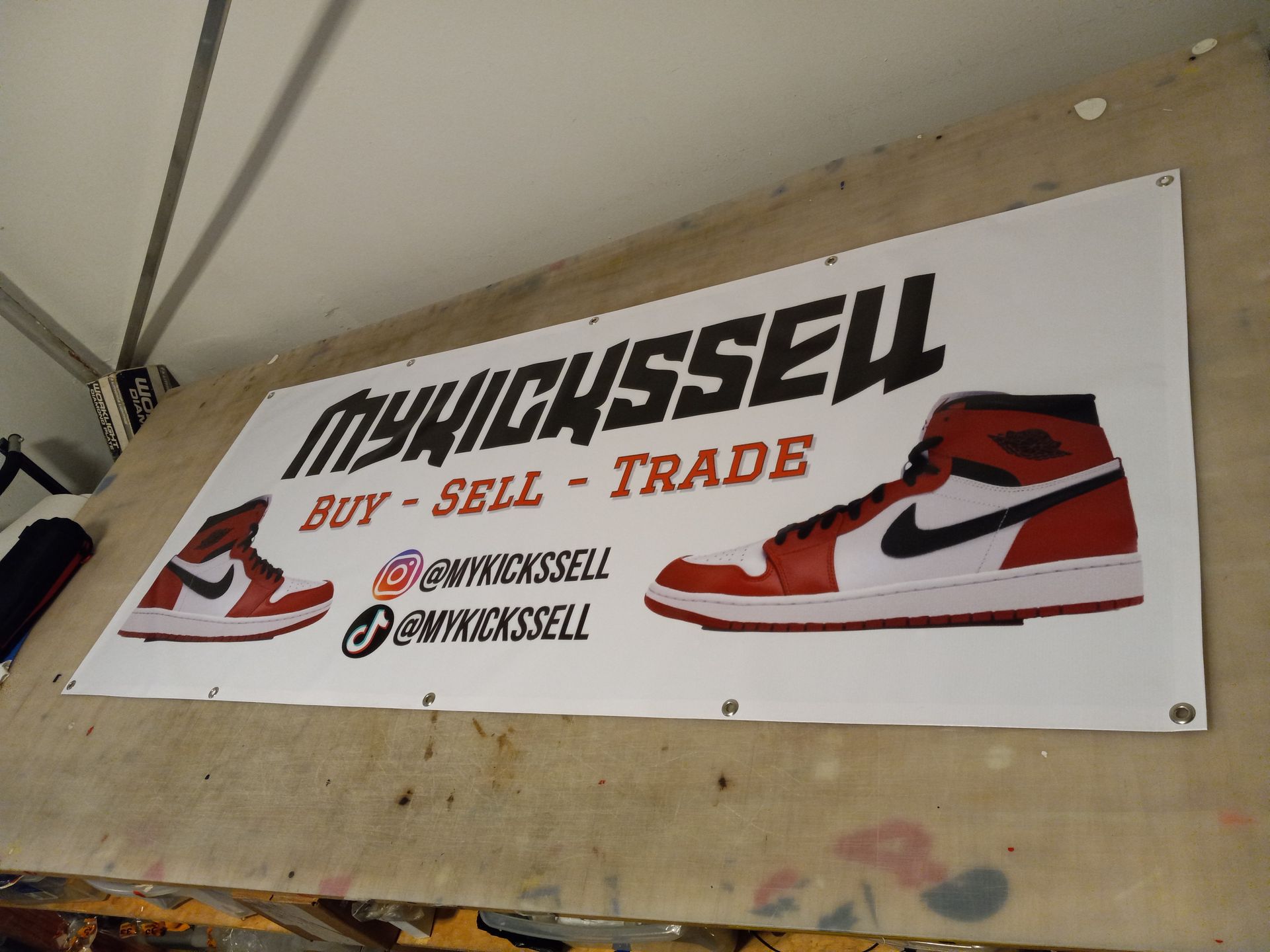 A sign that says ' mynickssell buy sell trade ' on it