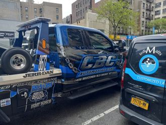 A tow truck with the word cbc on the side of it