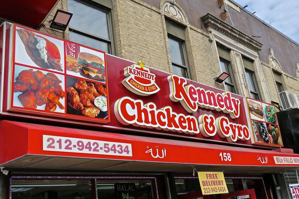 A chicken and gyro restaurant is located on the side of a building.