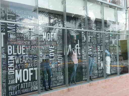 A store window with a lot of words on it.