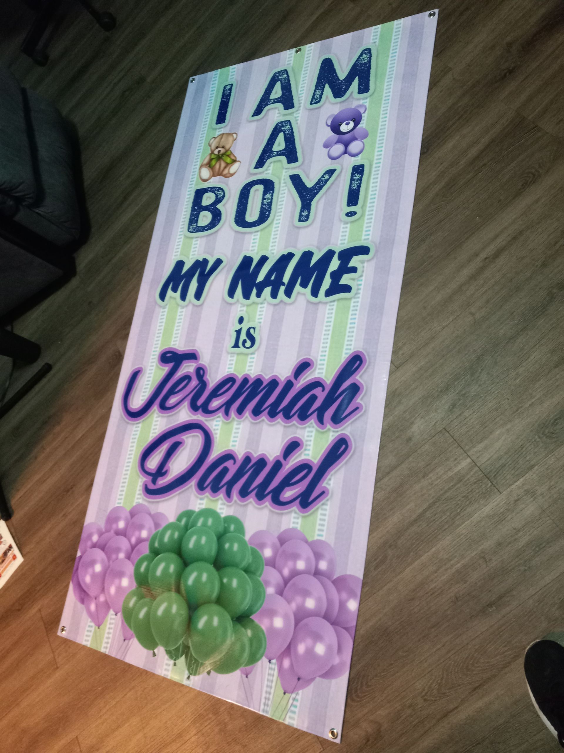 A sign that says i am a boy my name is jeremiah daniel